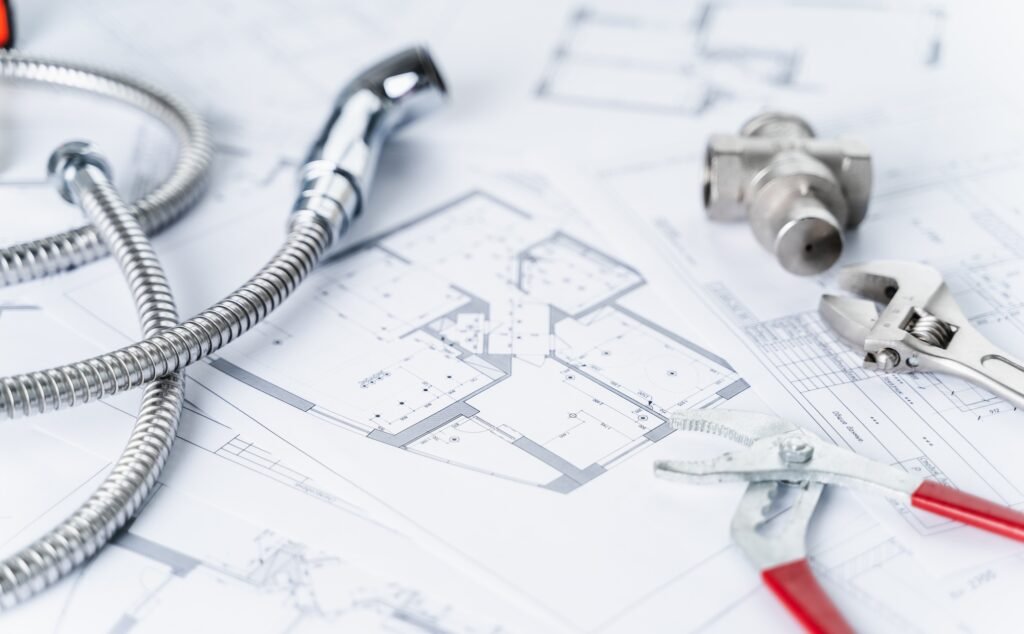 Plumbing project in house.Drawing,diagrams,plan of water supply of apartment,building.Man repairer m